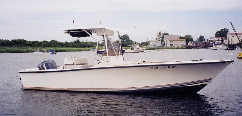 Atlantic Towers T-Top installed on a Sea Craft Center Console boat docked in calm waters.