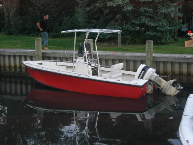 Atlantic Towers T-Top installed on a Sea Craft 18 center console boat moored at a dock.