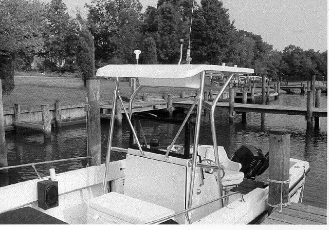 Atlantic Towers T-Top installed on a Sea Ox 20 Console boat at a dock by the water.