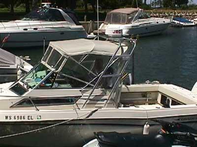 Atlantic Towers Arch installed on a Grady White 230/231/232 Gulfstream boat docked in a marina with other boats around.