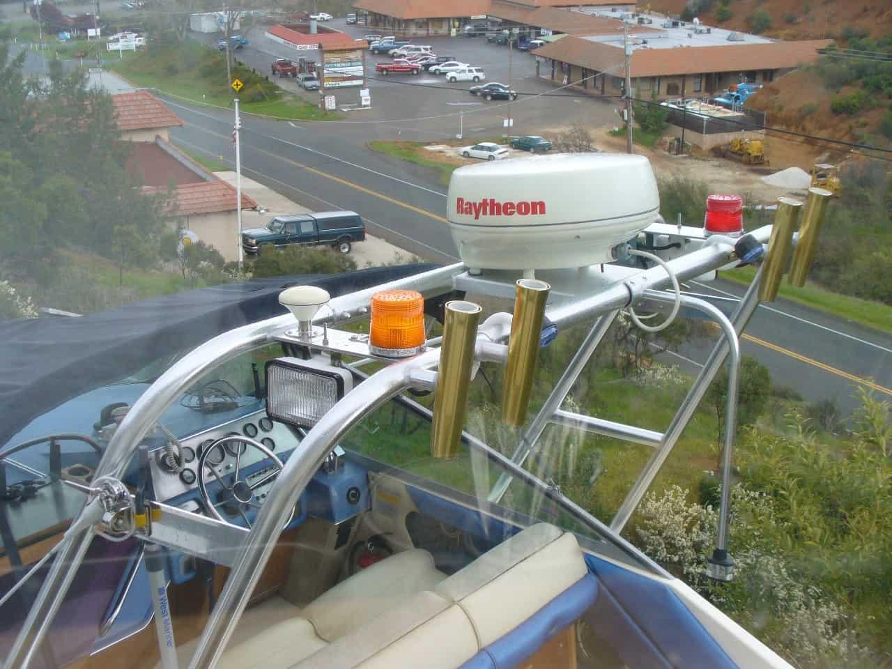 Atlantic Towers Arch installed on Sea Ray 260 Sundancer boat with mounted Raytheon radar and fishing rod holders.