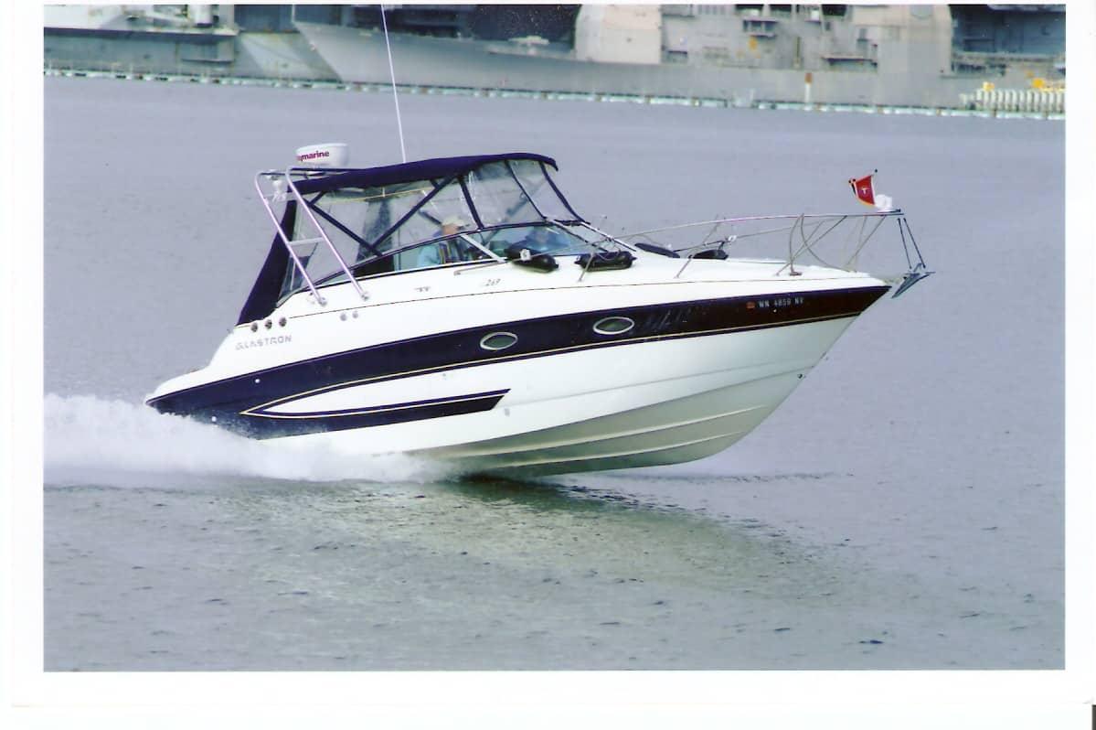 Atlantic Towers Arch installed on a Glastron GS269 boat cruising on the water, showcasing its sleek design.
