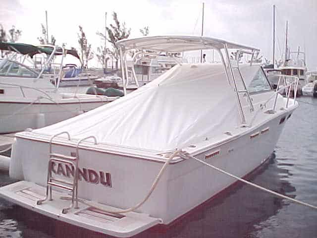 Atlantic Towers Top installed on a Tiara 27 Open boat, covered and docked at a marina.