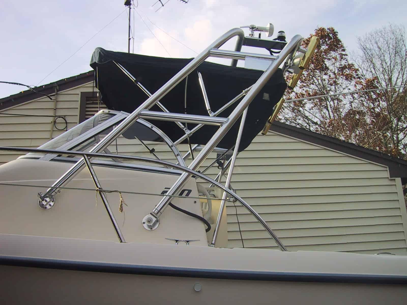 Atlantic Towers Arch installed on the bow of a Sea Era 210 boat with black canvas and residential background.
