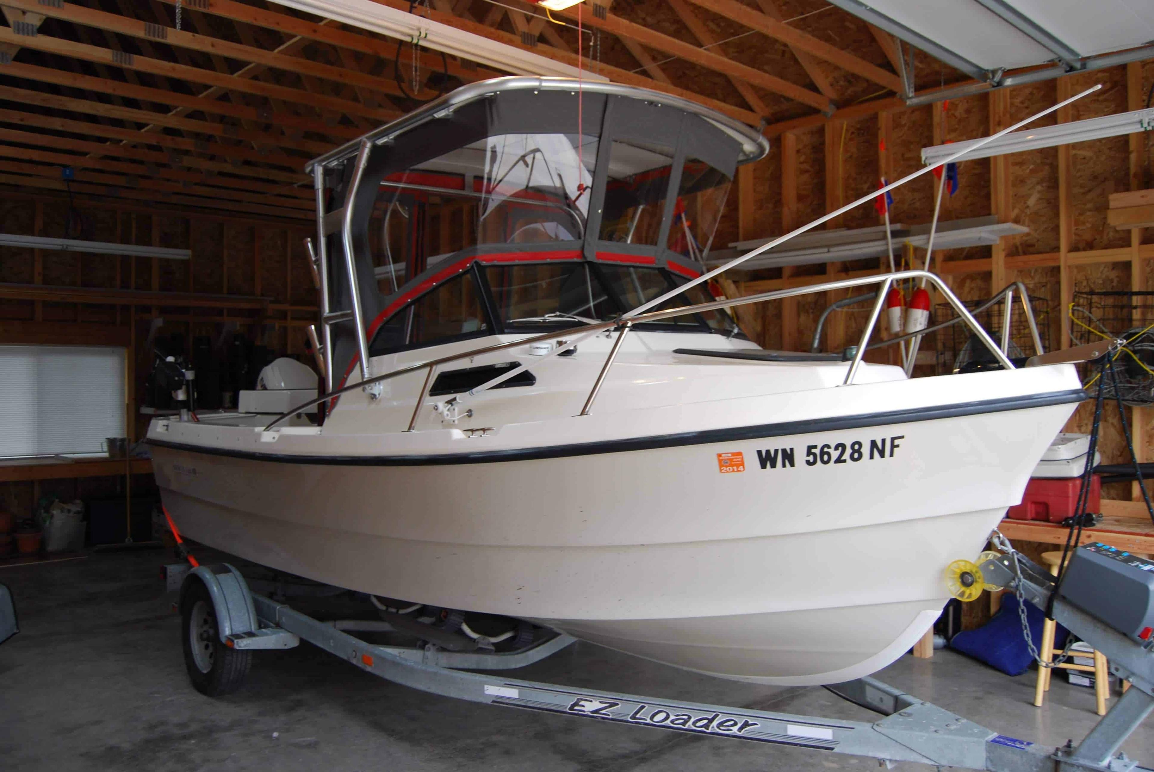 Atlantic Towers top on Arima 19 Seachaser walkaround boat, designed for enhanced shade and protection.