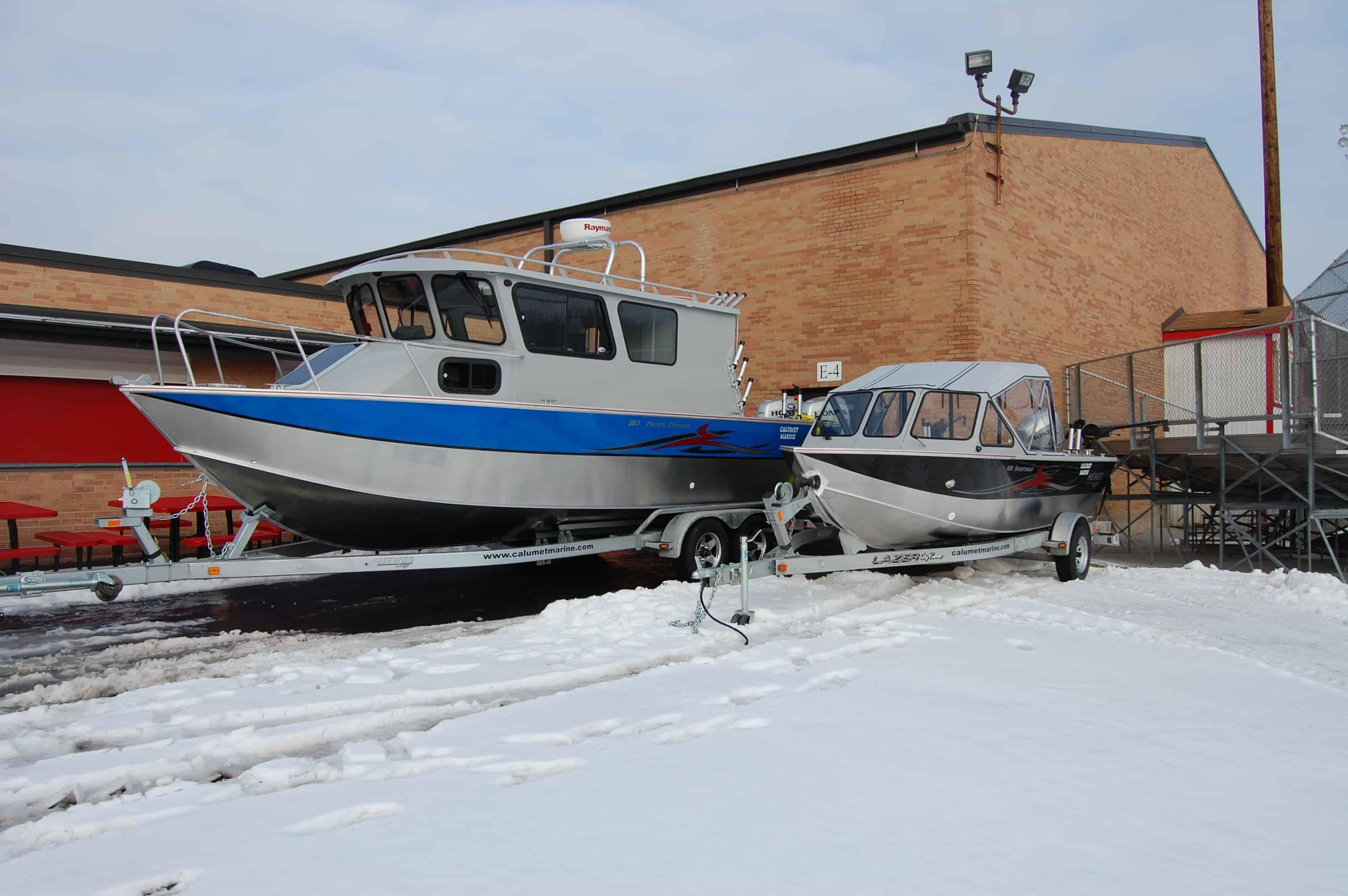 Atlantic Towers Arch installed on a Hewes 260 Pacific Cruiser closed helm boat shown from the side on water.
