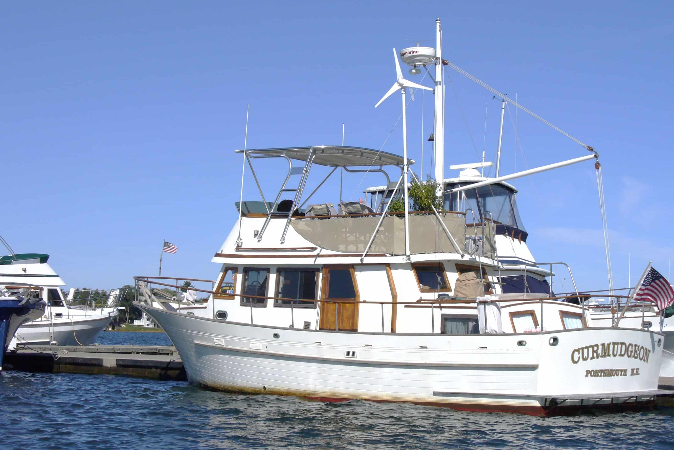 Atlantic Towers Top installed on an Albin 36 Trawler moored at a marina, showcasing its structure and features.
