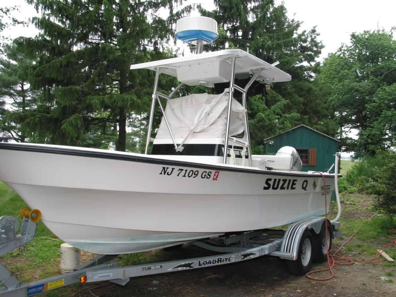 Maritime Skiff Super 50 Inside boat on trailer with Atlantic Towers T-Top roof and covered console in outdoor setting