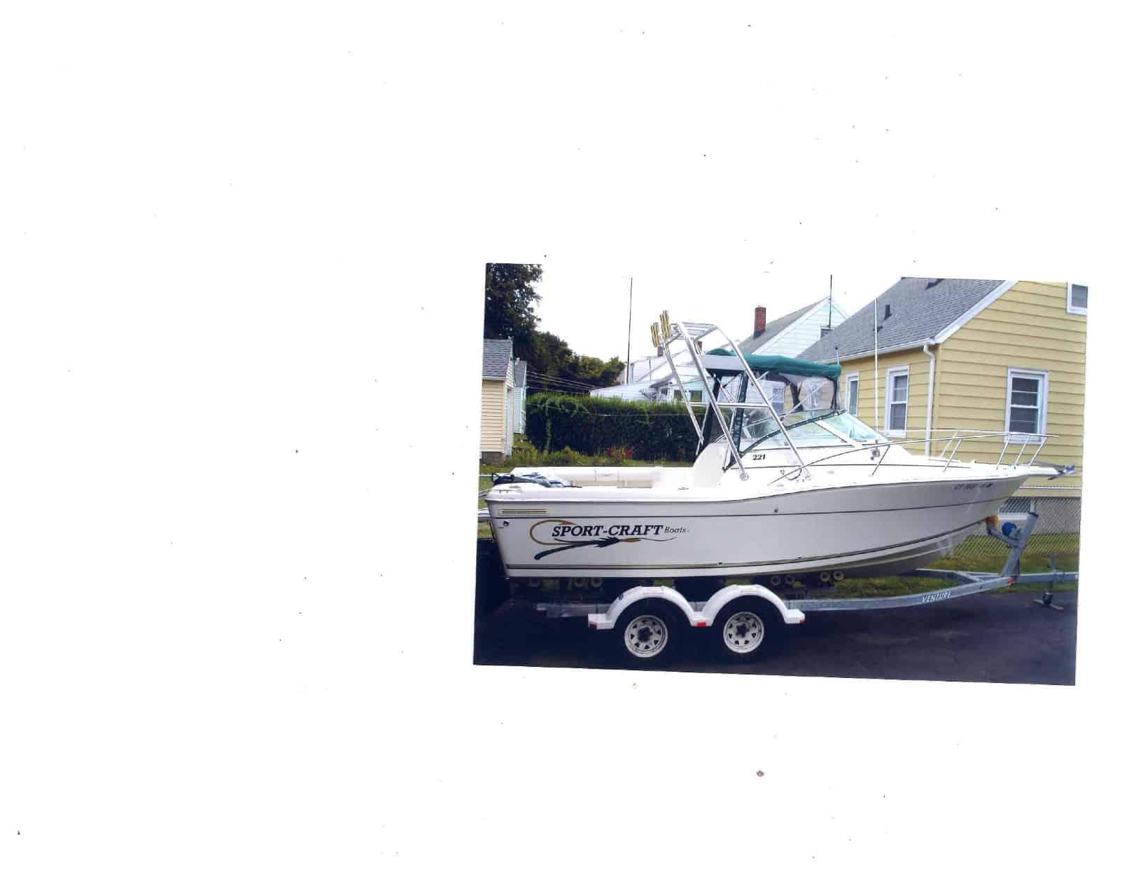Atlantic Towers Arch installed on a Sportcraft 211-221 Walkaround boat, parked on a trailer.