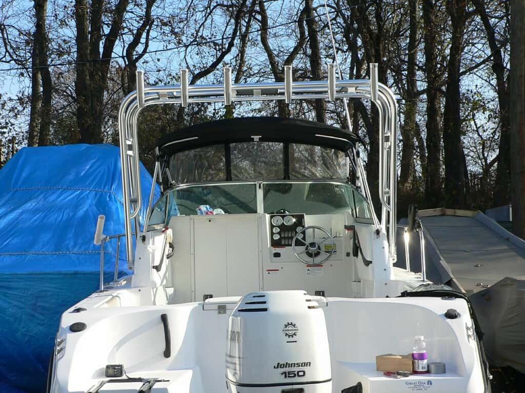 Seaswirl 2101 Walkaround Striper boat with installed Atlantic Towers arch viewed from the rear with an outboard motor Johnson 150.