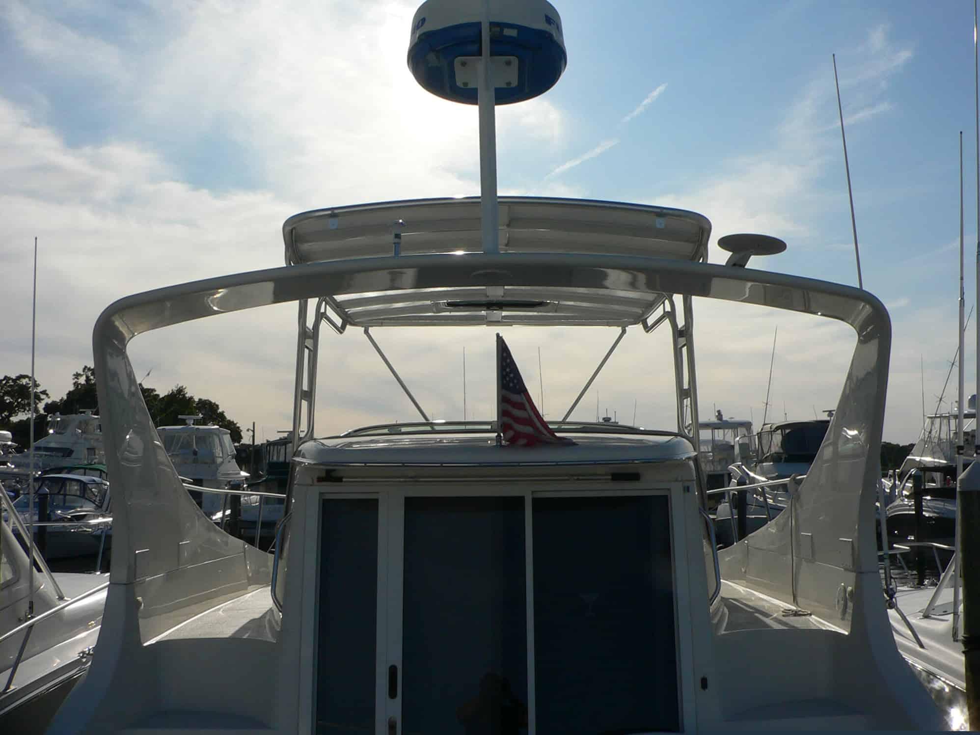 Rear view of a Carver 350 Mariner boat with installed Atlantic Towers Top arch and radar on the roof.