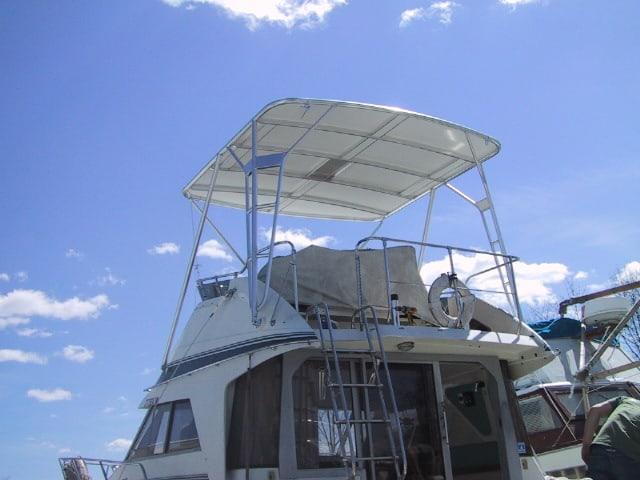Atlantic Towers Top installed on a Trojan 10.8 Meter boat, with a clear sky in the background.