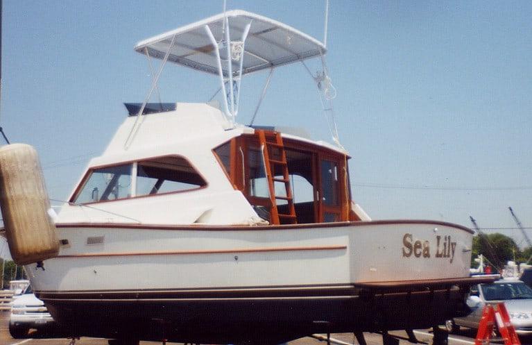 Atlantic Towers Top installed on an Egg Harbor 40 Sedan boat named Sea Lily, displayed on land.