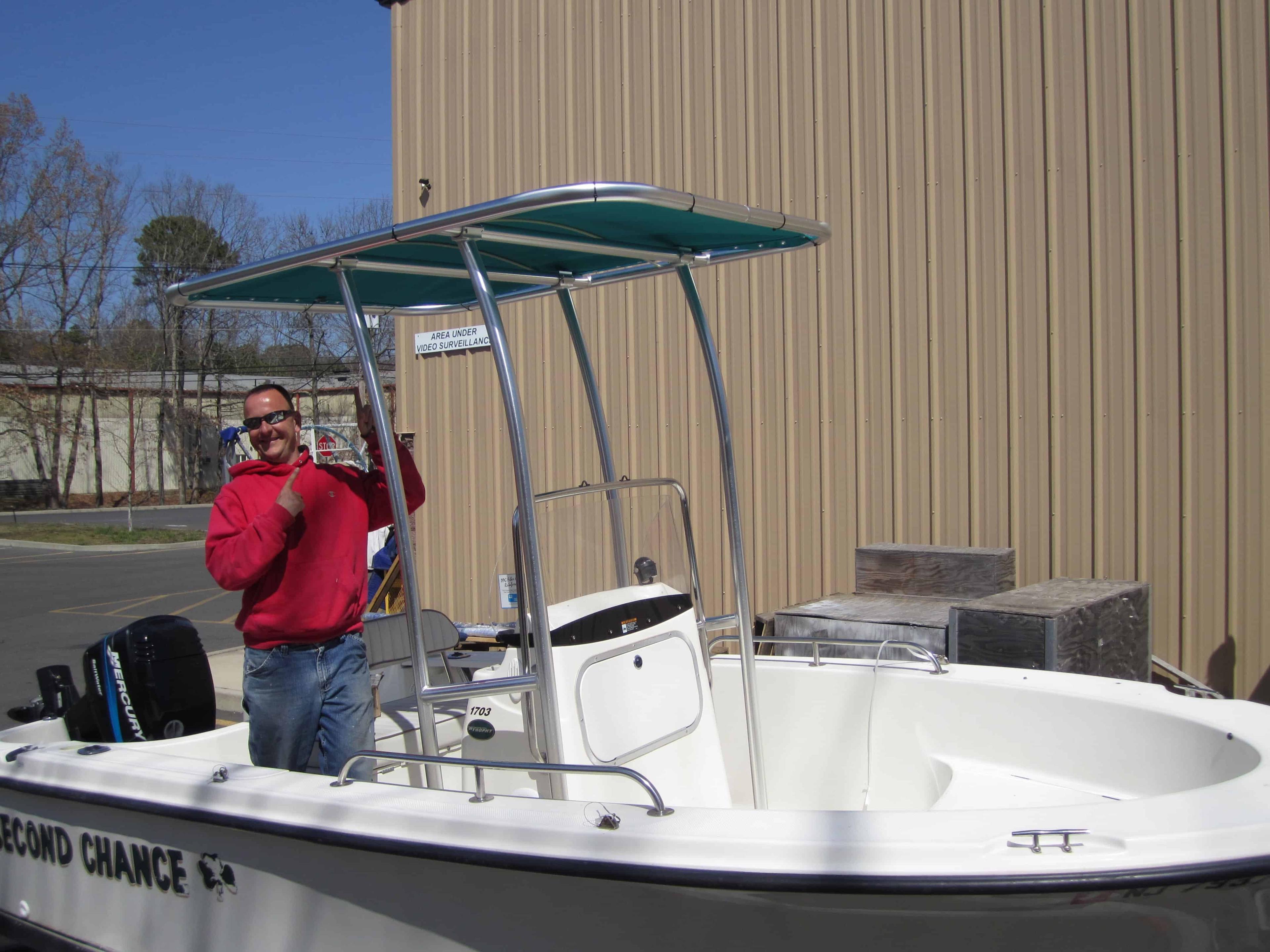 Atlantic Towers T-Top installed on a Trophy 17 center console boat docked by the water on a sunny day