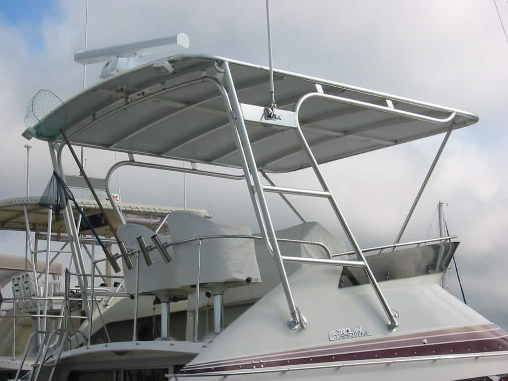 Trojan 12 Meter International boat equipped with Atlantic Towers Top aluminum T-top frame with canvas shade and mounted accessories.