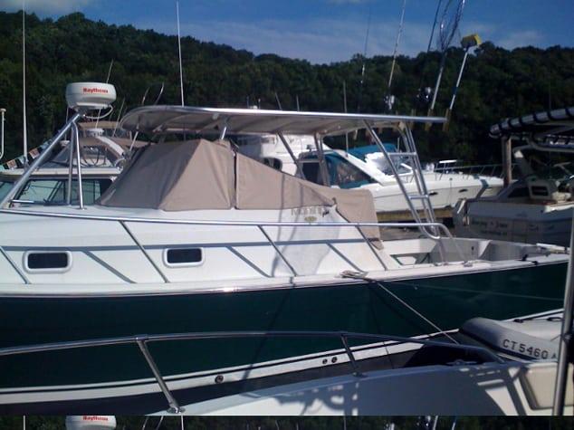 Atlantic Towers top installed on a Mainship 30 Pilot cruiser, providing shade and protection.