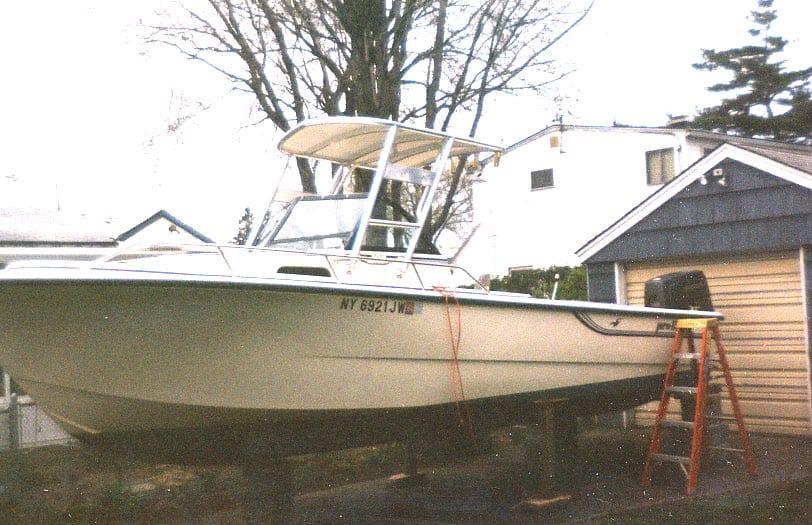 Atlantic Towers Top installed on a Pro Line 23 W/A boat, positioned on stands near a residential area.