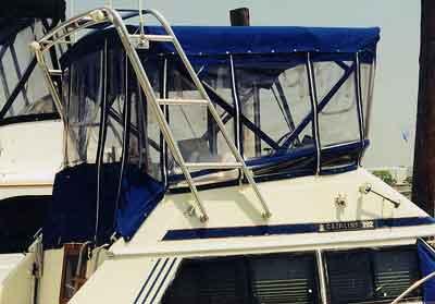 Atlantic Towers Arch installed on a Chris Craft 292 Sunbridge boat, featuring a blue canvas top and clear enclosures.