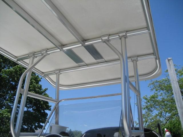 Atlantic Towers Top installed on a white Hydra Sports 212 walkaround boat on calm water under clear skies