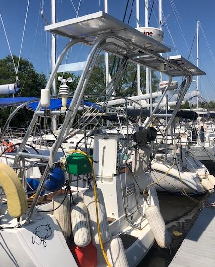 Atlantic Towers Arch installed on a boat, surrounded by other vessels at a marina on a sunny day.