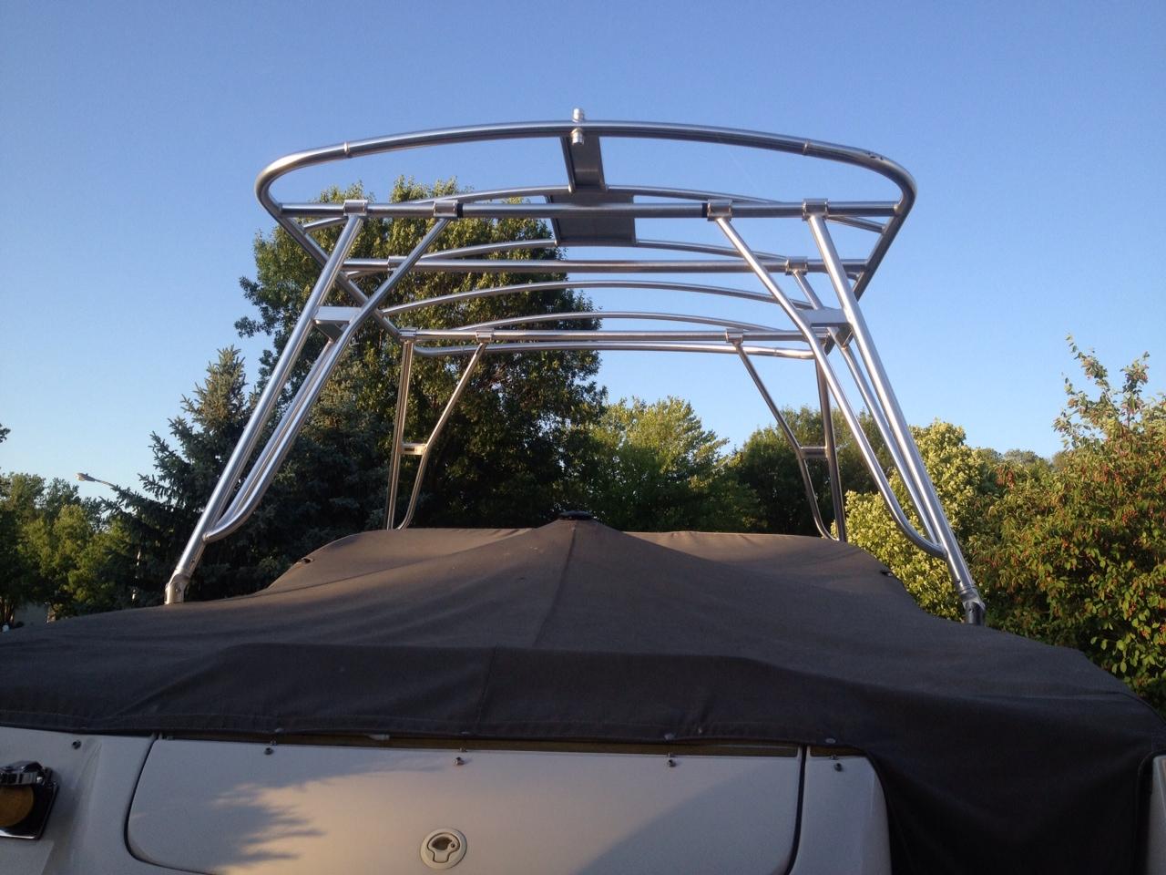 Atlantic Towers Top installed on a Monterey 248 LS boat, with a clear sky and trees in the background.