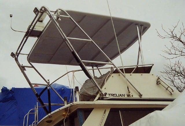 Atlantic Towers Top installed on a Trojan boat, featuring a sleek design and protective cover.
