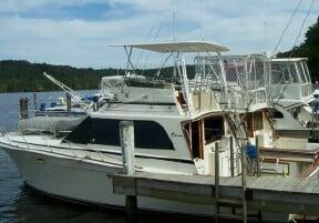 Atlantic Towers Top installed on an Egg Harbor 41 convertible sedan boat docked by the water.