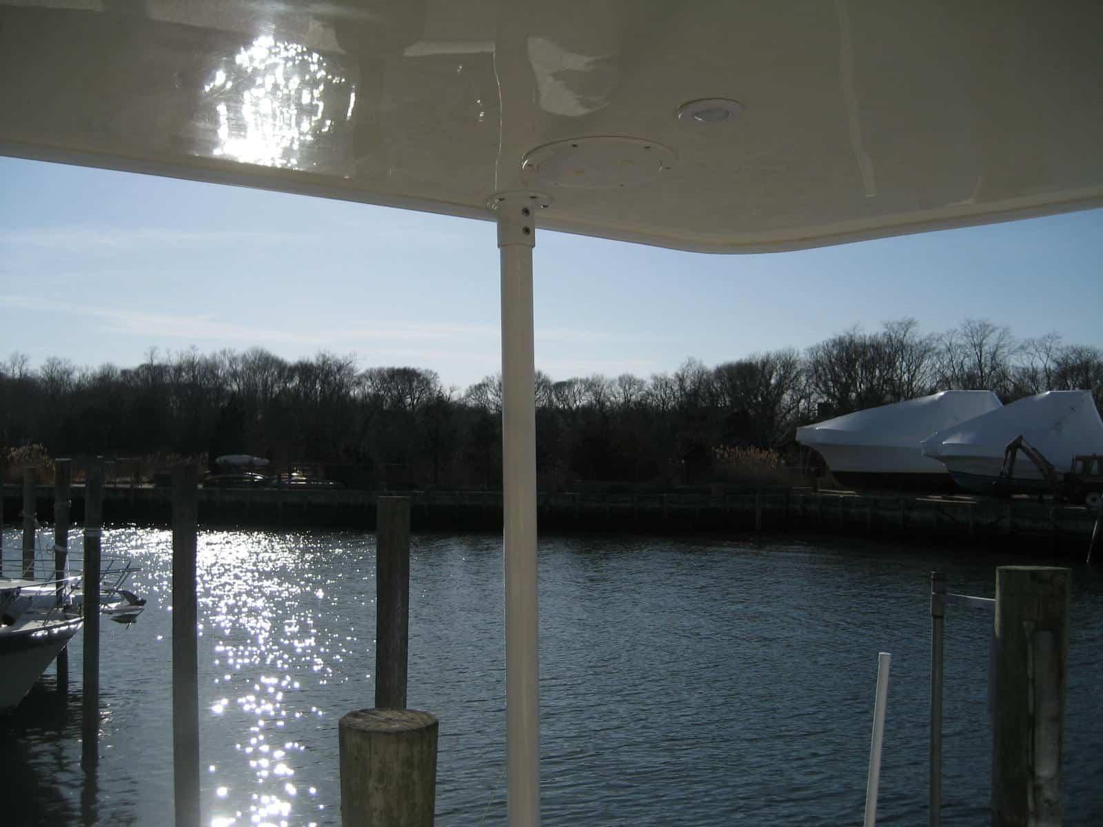 Atlantic Towers Top installed on a Meridian 459 CPMY Cockpit Motor Yacht, showing the cockpit area on the water.