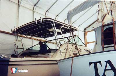 Atlantic Towers Top installed on a Wellcraft 330 Coastal boat inside a storage facility.