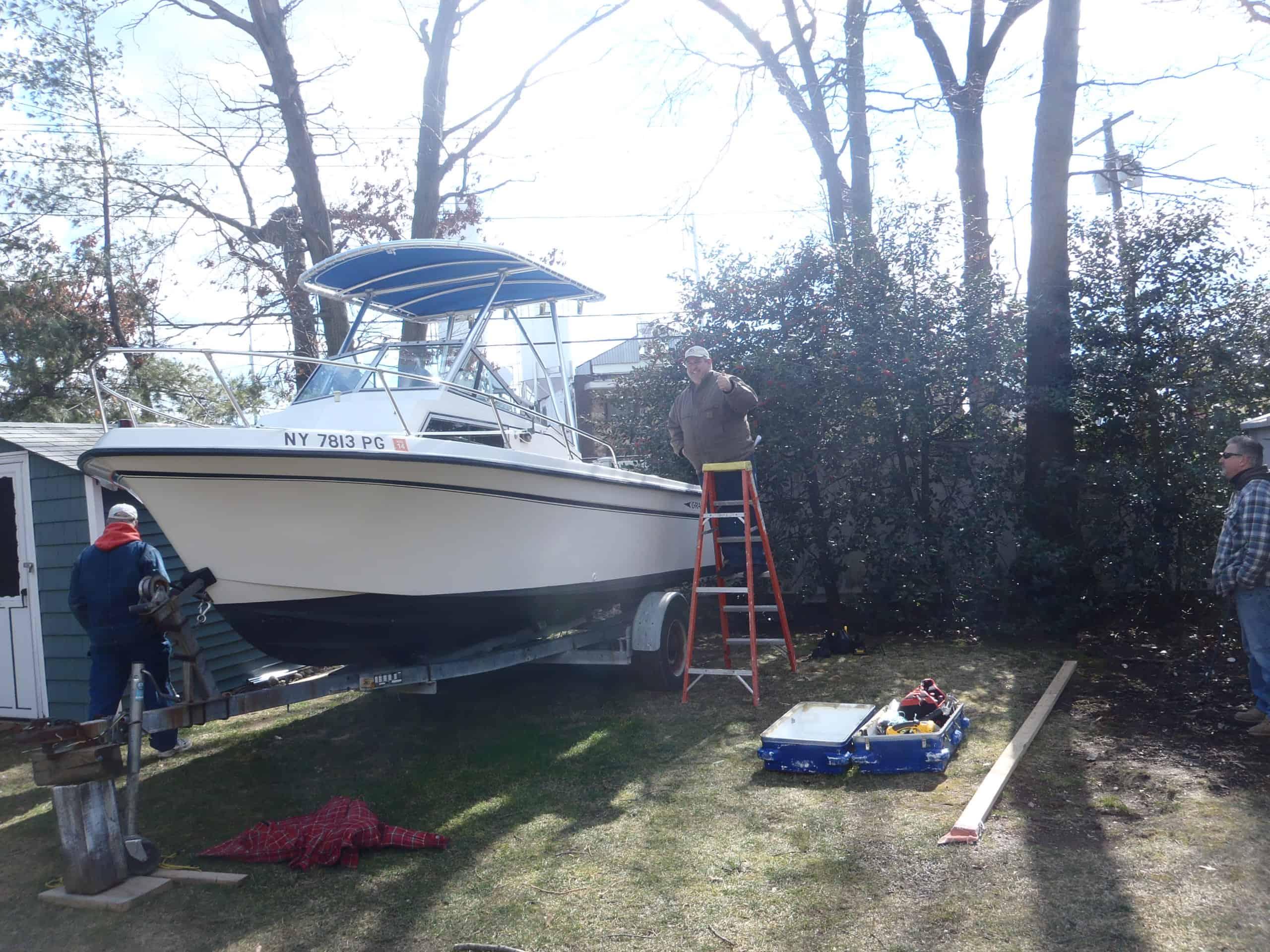 Atlantic Towers Top installed on Grady White 204 Overnight walkaround boat, showing frame and canvas support structure.