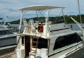 Atlantic Towers Top installed on an Egg Harbor 41 Convertible Sedan, featuring multiple fishing rod holders and a spacious design.