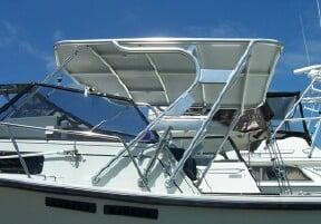 Atlantic Towers Top installed on a Rampage boat, featuring a silver metal frame and canopy above the deck.