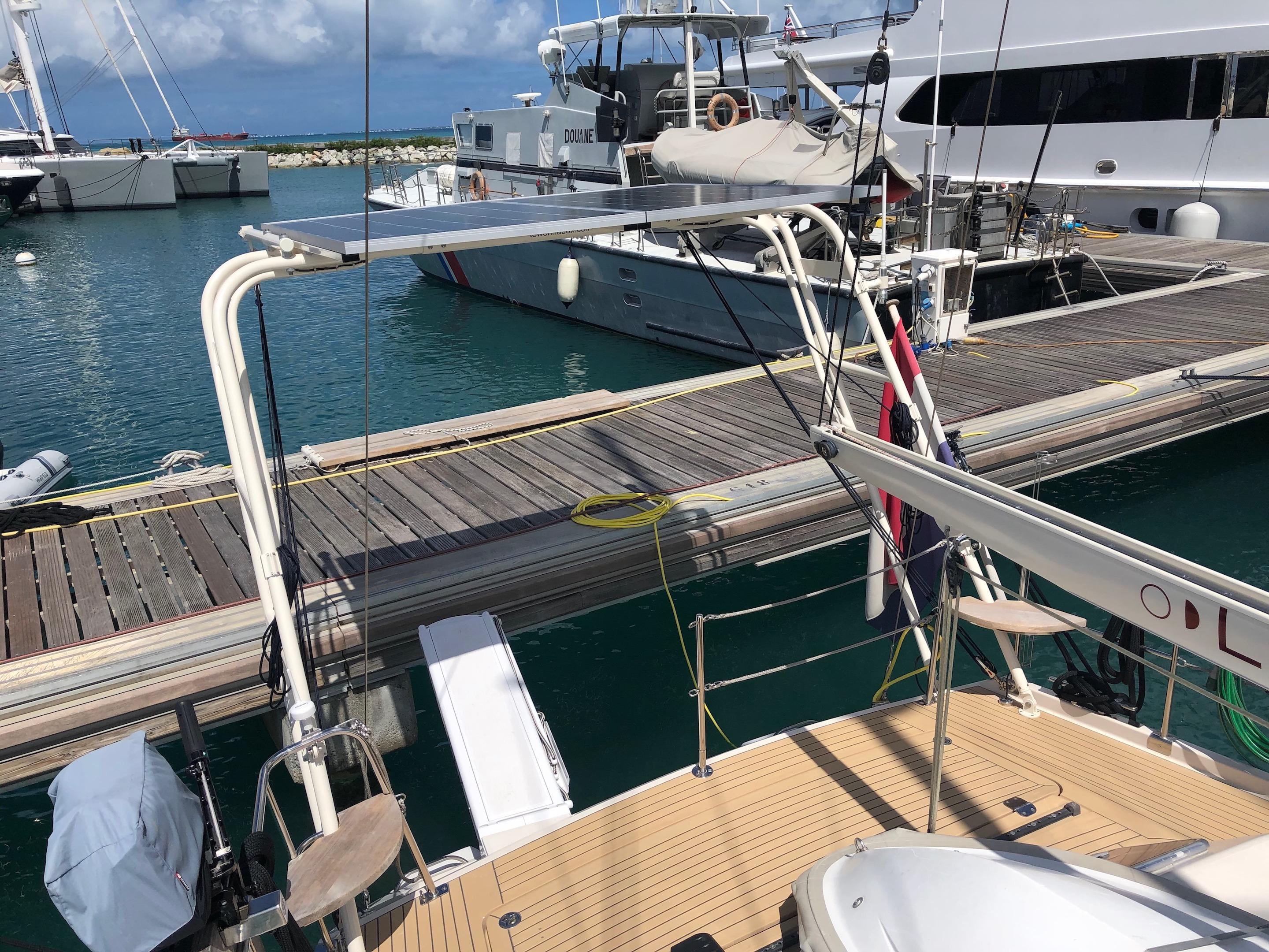 View of the Atlantic Towers Arch installed on a boat docked near other vessels in a marina setting.