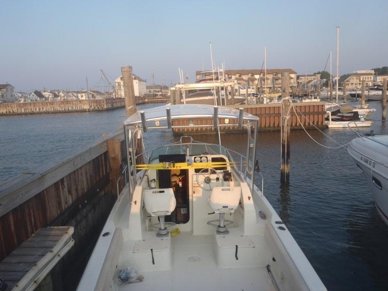 Atlantic Towers Top installed on Hydra Sports 230 w/a boat with white hull and blue water background.