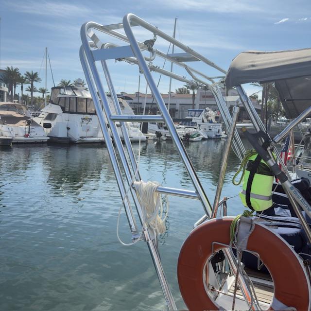 Atlantic Towers Arch mounted on a boat, with a marina and other vessels visible in the background.