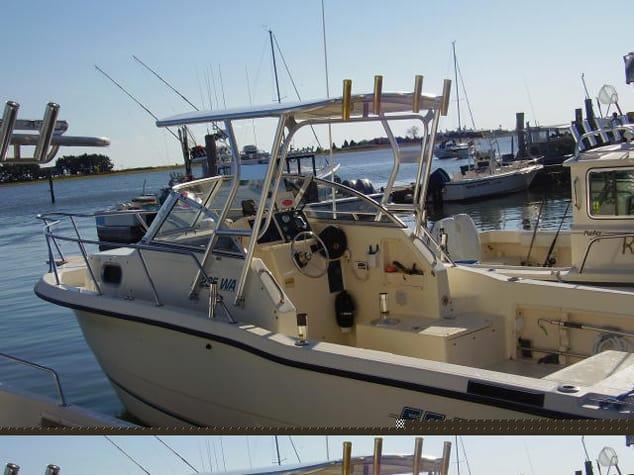 Sea Pro 235 Walkaround boat docked at marina with Atlantic Towers Top installed over the helm area
