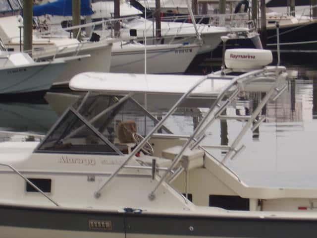 Atlantic Towers Top installed on an Alura 30 boat moored among other vessels in a marina.