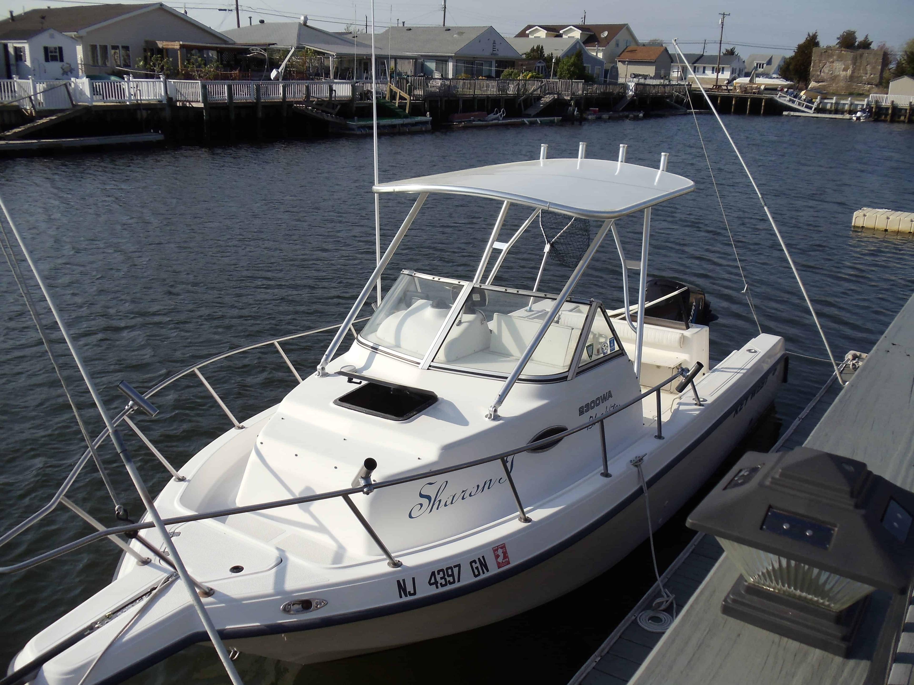 Atlantic Towers Top installed on a Key West 2300 Bluewater boat docked by the water.