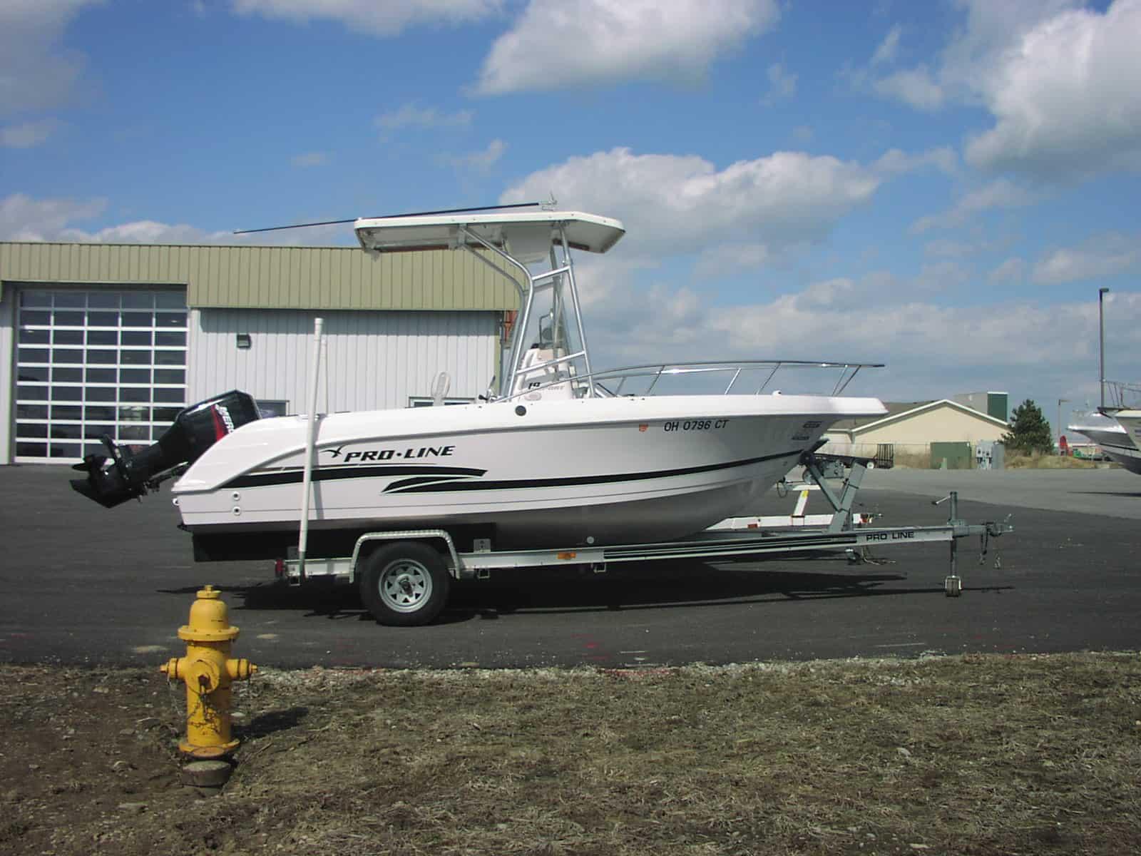 Atlantic Towers T-Top installed on a Pro Line 20/21 Sport center console boat against a clear sky background.