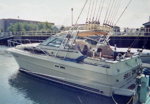 Atlantic Towers Arch installed on a Sea Ray 340 Sundancer express cruiser, showing the boat's upper structure and sails.