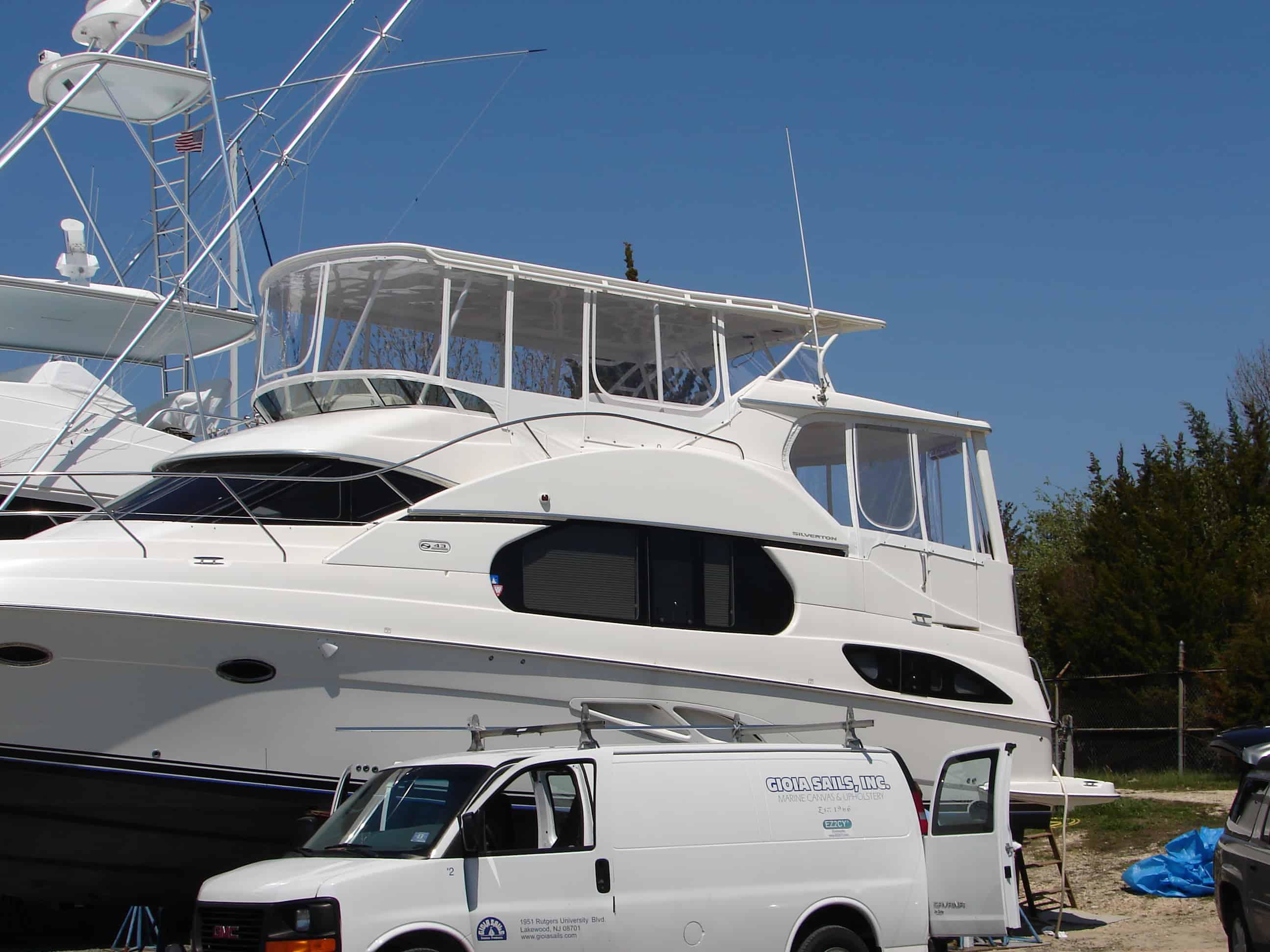 Atlantic Towers Top installed on a Silverton 43 Motor Yacht parked near several other boats.
