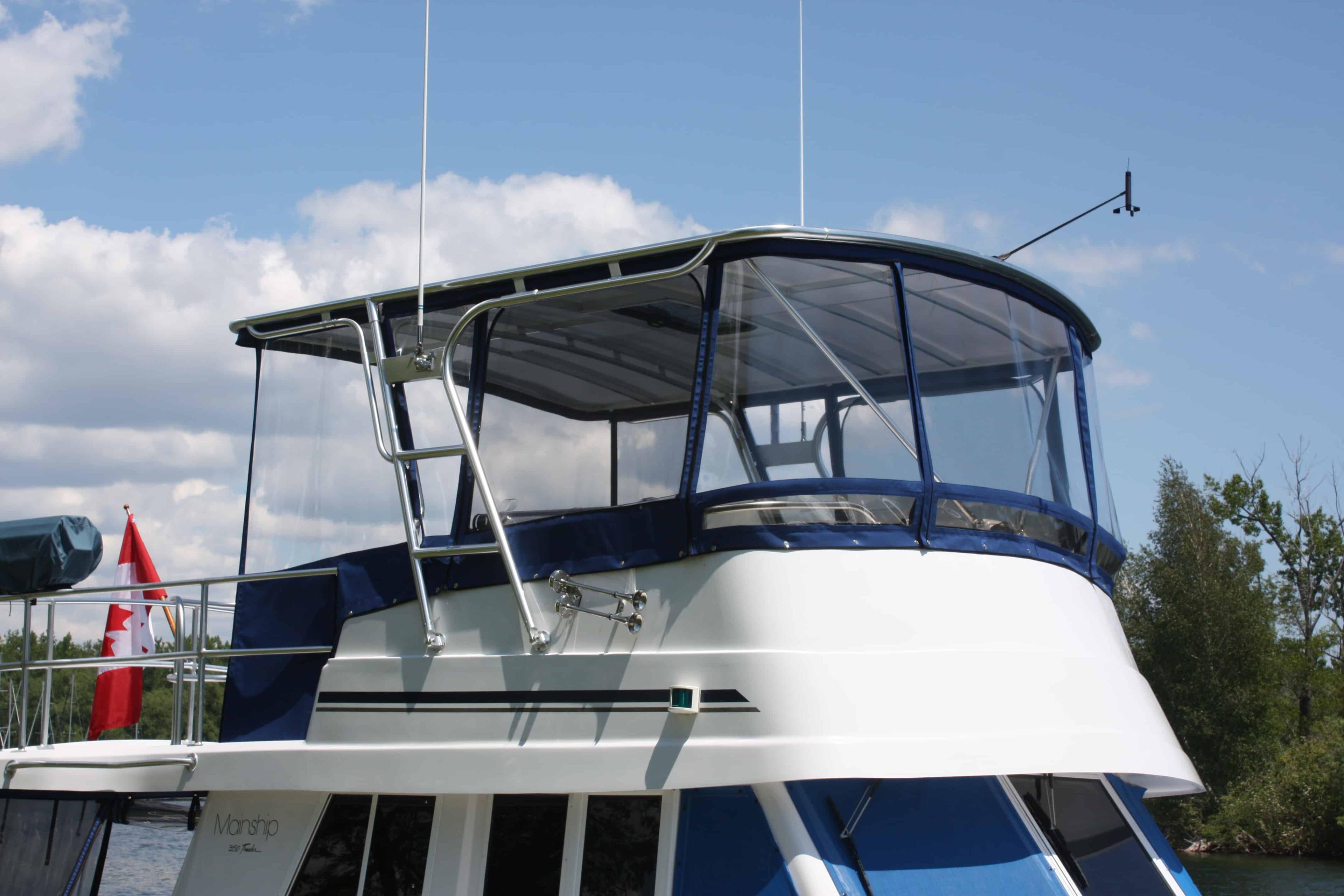 Atlantic Towers Top installed on a Mainship 350/390 Trawler, showcasing the boat's canopy and design features.