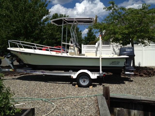 Atlantic Towers T-Top installed on a Panga 18 Isle Marada center console boat docked on calm water under clear sky