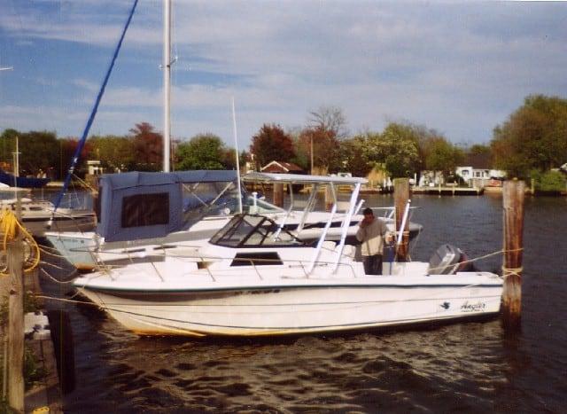 Atlantic Towers Top installed on an Angler boat docked at a marina on a sunny day, alongside other vessels.