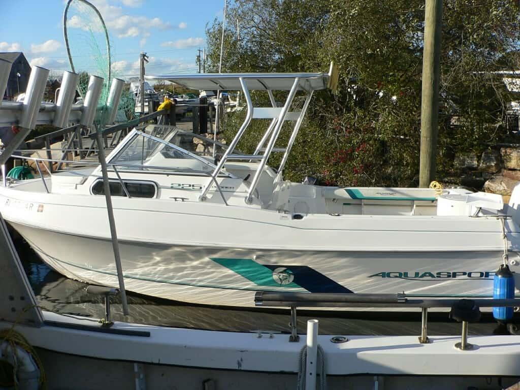 Atlantic Towers Top installed on an Aquasport 225 Explorer walkaround boat, providing enhanced coverage and support.
