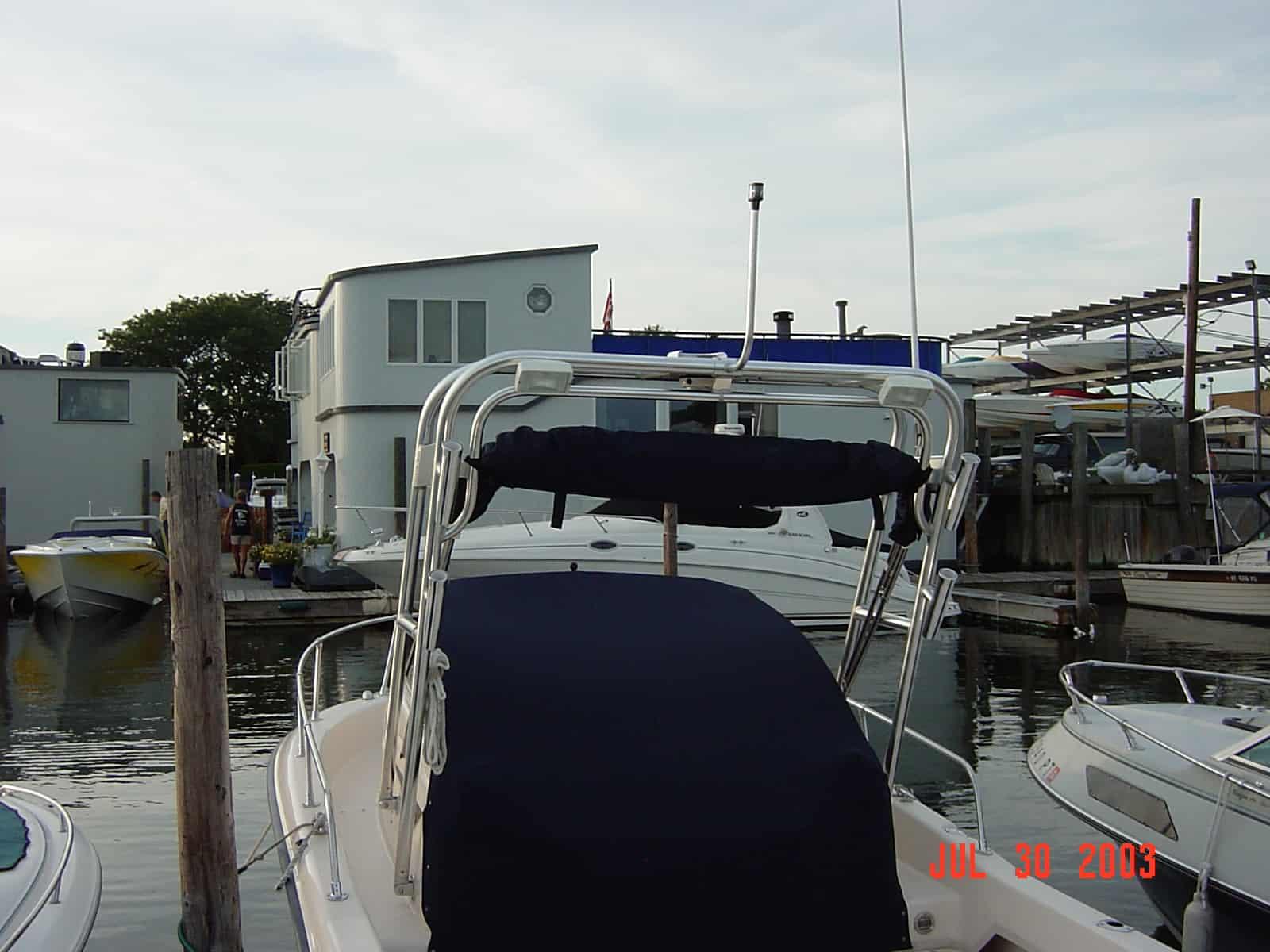Atlantic Towers arch on a Grady White 208 Adventurer walkaround boat in a marina setting.