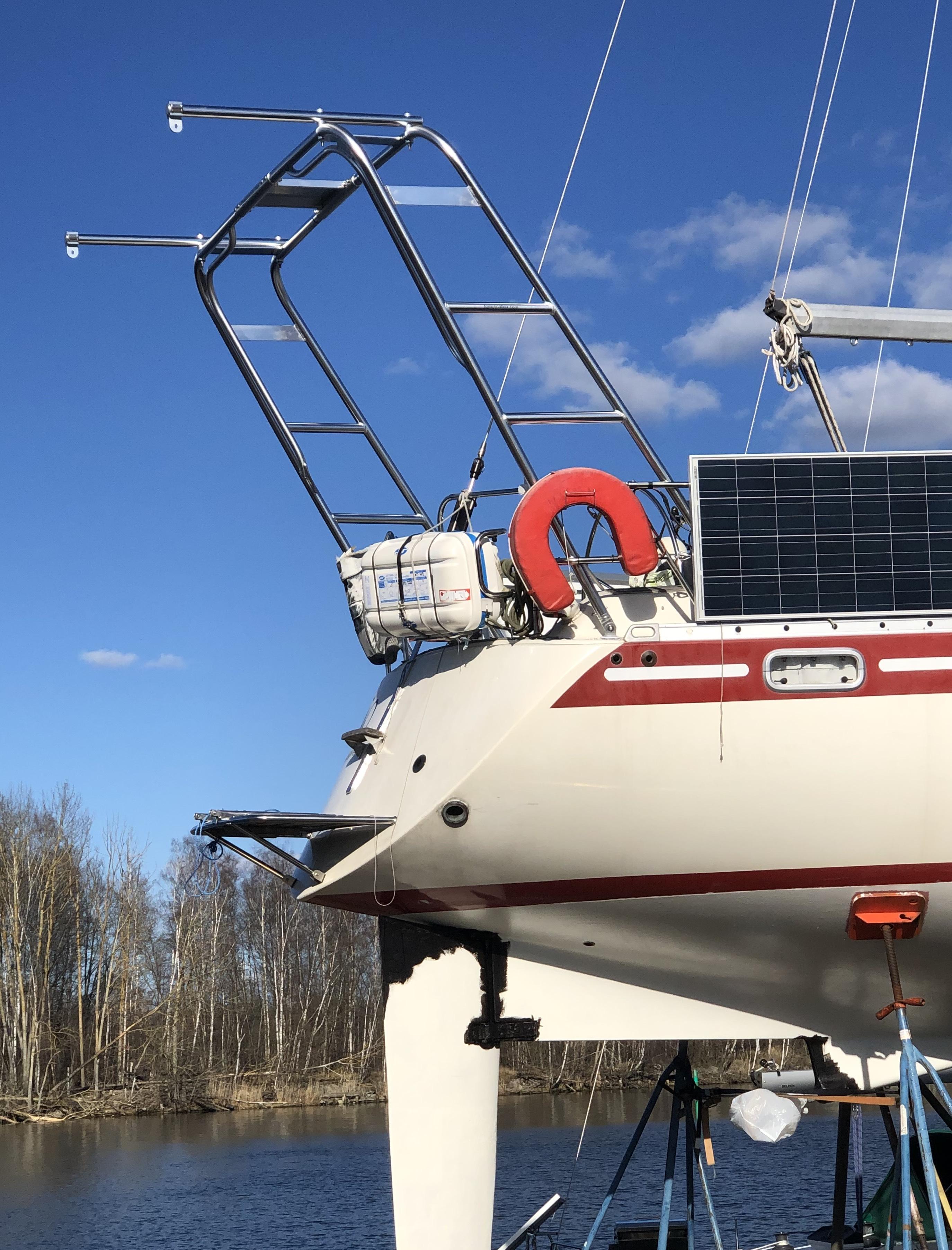 Atlantic Towers Arch installed on the stern of a Scanner boat, showing a ladder and mounted equipment under a clear blue sky.