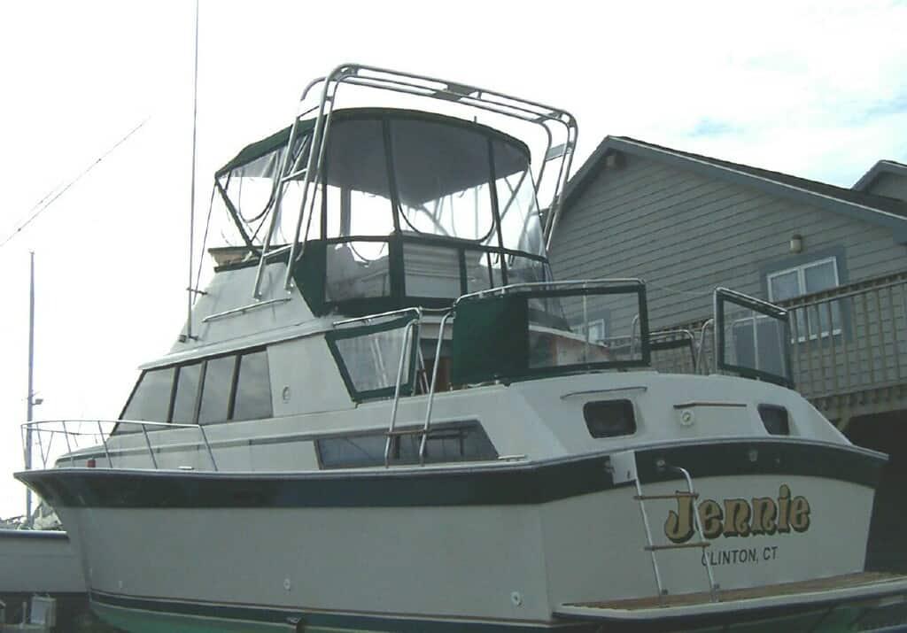 Silverton 40 Aft Cabin boat featuring an installed Atlantic Towers arch on the aft cabin deck against a clear sky.