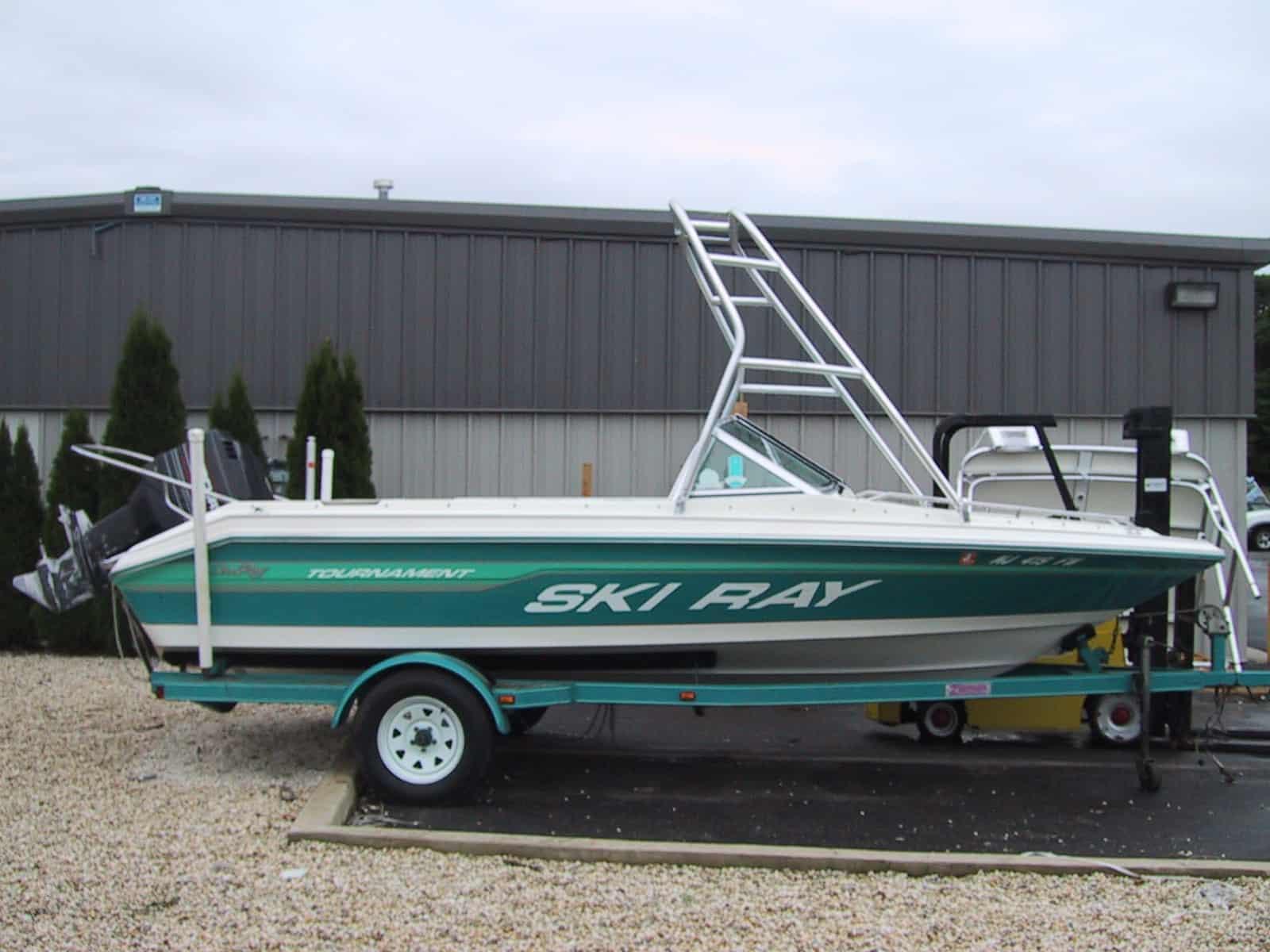 Sea Ray 190 SkiRay O/B boat on trailer with installed Atlantic Towers Air Tower against a building background