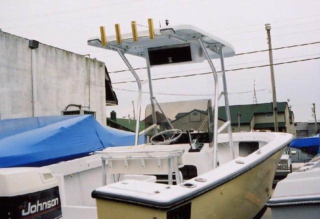 Sea Craft 23 Center Console boat with installed Atlantic Towers T-Top and fishing rod holders at a dock.